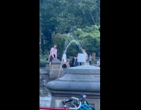 Man sit and hump at water fountain