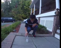 Guy land back flip and bottle flip