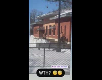 Two shirtless guys throw pass ball snow 