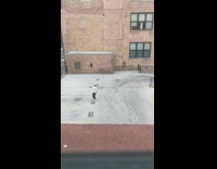 man throw green shirt in air parking lot