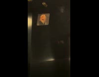 Picture of long haired man in elevator