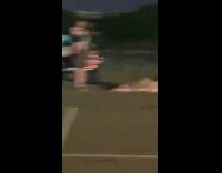 Black shorts girl straddles friend laying down 