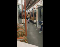 Girl dances alone train orange seats 