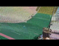 Blue pants guy skis down grass slope