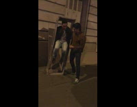 Guy sits inside tall wooden crate frame and breaks it 