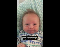 Parent shows what newborn stage is like