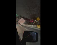 Big rig tilted on one side almost falling over