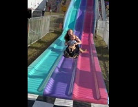 Child scream after finishing slide with mom