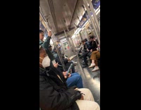 Man rides subway holds leftover aluminum pan