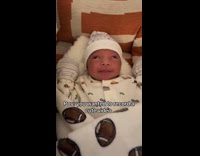 Baby rolls eyes woman films cute video