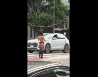 Woman black bikini boots tripod California street