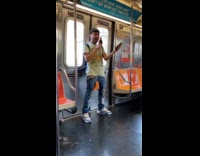 Guy with microphone sings karaoke on train