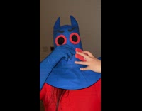 Woman in Man Ray costume takes shot 