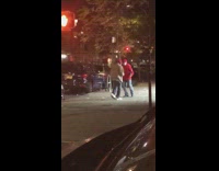 Two guys hold hands dance sidewalk hat