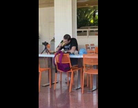 Guy shirt eat sandwich food orange chair