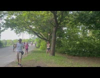 Man produces big bubbles for the kids nearby