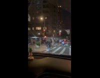 Crowd in costume skates on the street