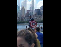 Captain America walks down path at park 