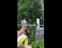 Woman summer bikini selfie timer white fence