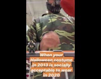 Guy wears bane halloween mask 