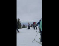Lady in Ski Attire Poses and Smiles 