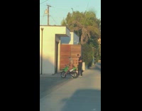 Black bikini girl green dirt bike guy