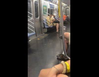 Guy eats chicken leg during rain ride