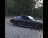 Blue shirt guy black car donuts 