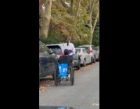 Collab WINY - Woman rides scooter pulls man on wheelchair