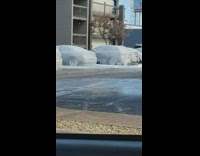 Cars frozen and covered in ice and water pipe broke