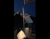 Blue shirt guy on boat throws up 