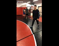 Guy lifts throws friend over shoulders court