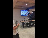 Group chant as guy on bike tumbles off of table