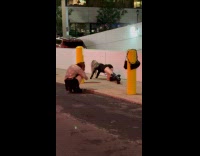 Woman bend over pose for sidewalk photo
