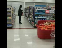 guy in black running with red target basket
