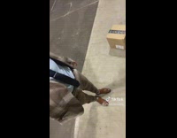 Man wears a nice suit and unboxes a package 