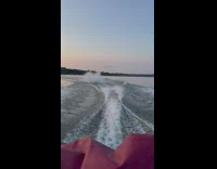 Guy wakeboarding falls into water 