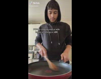 Guy black hoodie red pan cooking pretends to hit air
