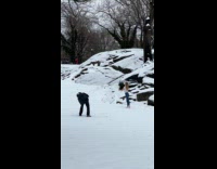 Woman ballet pose at the snowy park