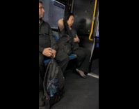 Woman brush hair during bus ride