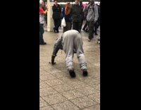 Man dances to music in subway, gets on all fours and starting running