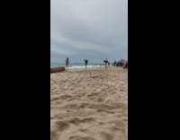 two girls cartwheel beach