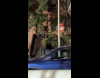 Guy crawls at apartment wall like Spiderman