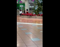 Woman red dress poses on Christmas decorations
