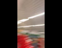 Man with paint like panda inside store