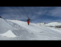 Man Skis Downhill to Ramp and Overflips