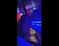 Lady smiles at own reflection in mirror 