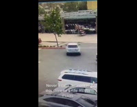 Silver car runs into island and tree instead of turning into road 