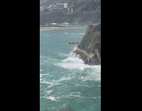 Girl sits on railing edge for photo