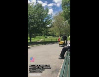 Man rides red scooter with bicycle trailer and plays Fresh Prince of Bel Air theme song